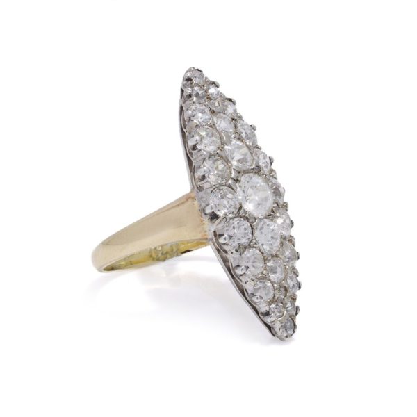Antique diamond cluster ring in gold and silver.