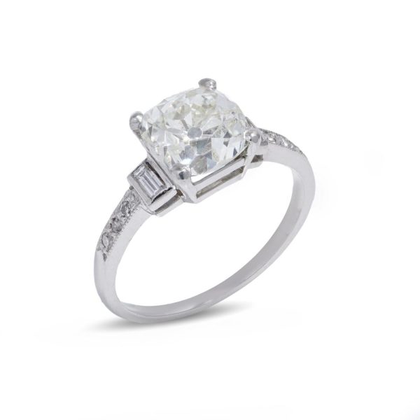 Antique Diamond engagement ring, cushion cut platinum diamond baguette shoulders and band