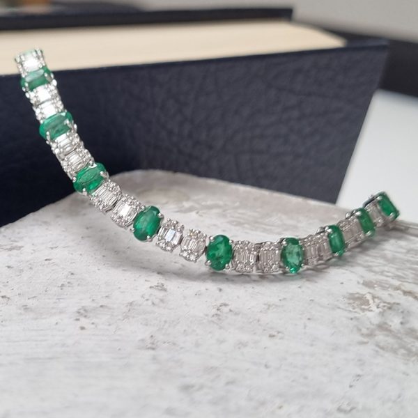 Oval Cut 6.72ct Emerald and Diamond Line Tennis Bracelet in 18ct White Gold