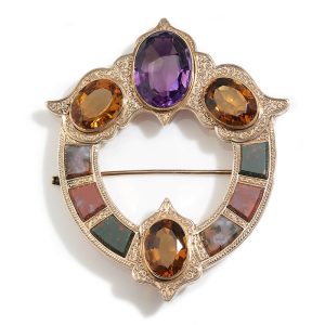 Victorian Celtic Tara brooch in gold, set with amethyst, citrines and agates.