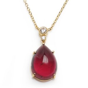 Diamond topped tourmaline pendant with a gold trace chain.