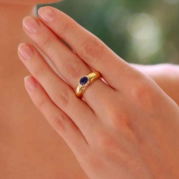 Garrard & Co. blue sapphire gypsy ring set in yellow and white gold.