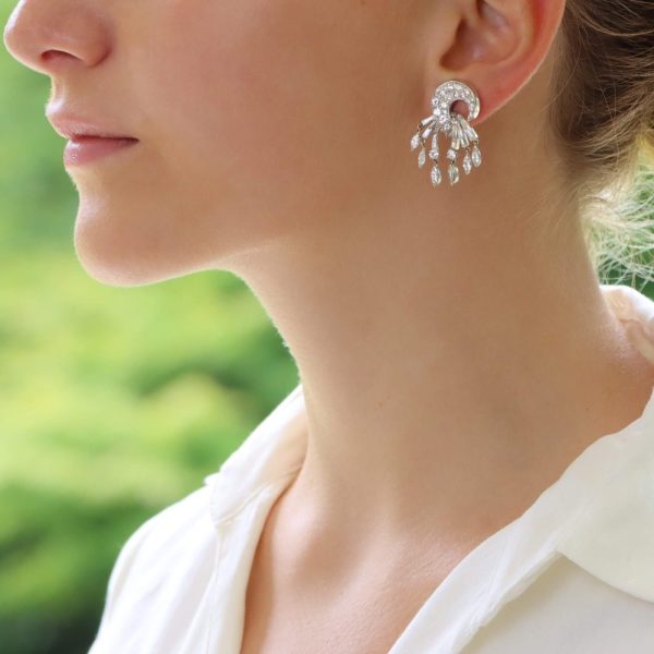 Diamond drop clip-on earrings set in platinum and gold.