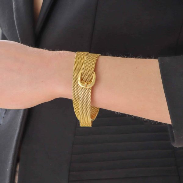 Vintage Hermès belt buckle wrap bracelet set in 18 carat yellow gold.