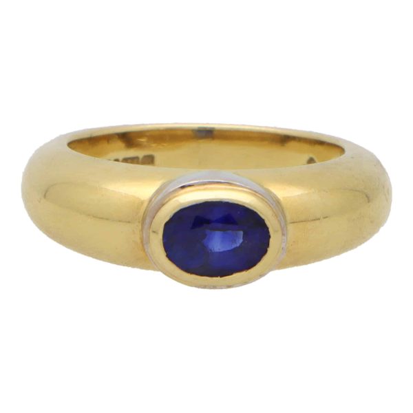 Garrard & Co. blue sapphire gypsy ring set in yellow and white gold.