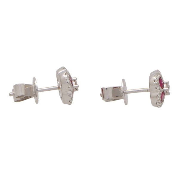 Ruby and diamond cluster earrings in white gold.