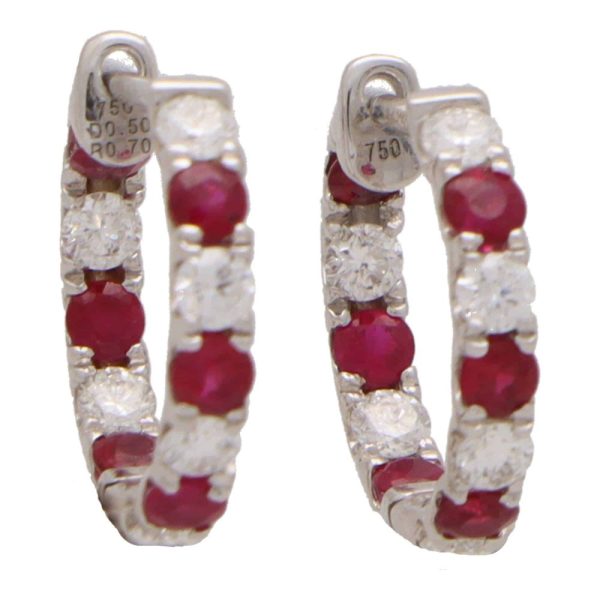 Ruby and diamond hoop earrings in white gold.