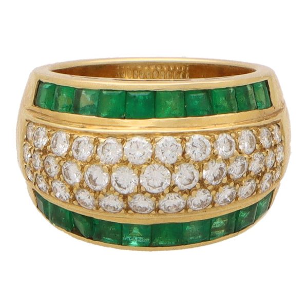 Vintage emerald and diamond bombe ring in yellow gold.