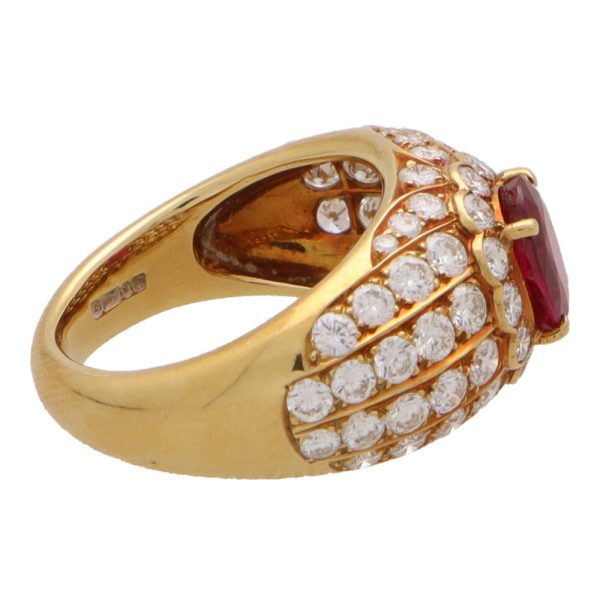 Vintage ruby and diamond cluster bombe ring in yellow gold.