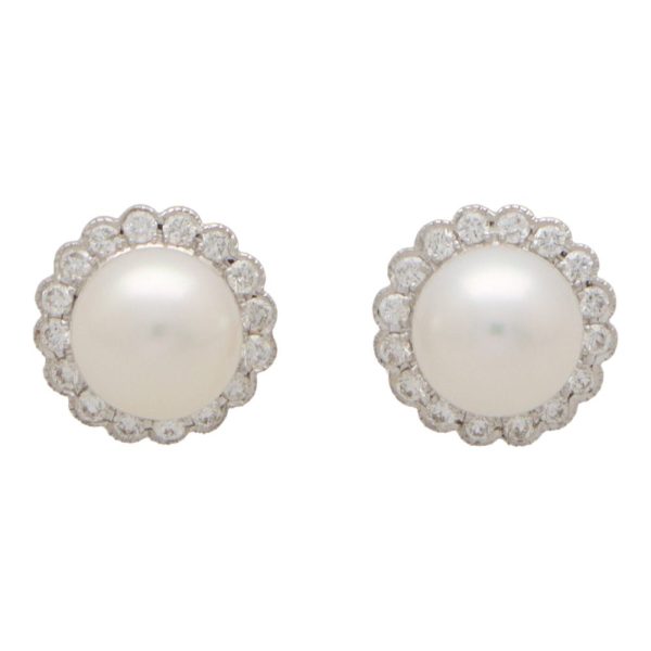 Pearl and diamond cluster earrings in white gold.