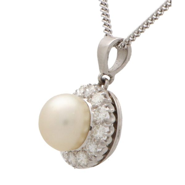 Diamond and pearl pendant necklace set in 9 carat white gold.