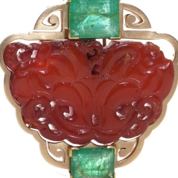 Chinese gold amber clip brooch with emeralds.