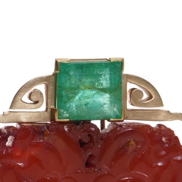 Chinese gold amber clip brooch with emeralds.