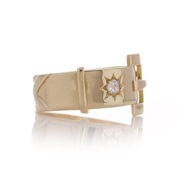 Antique men's belt buckle gold ring accented a diamond.