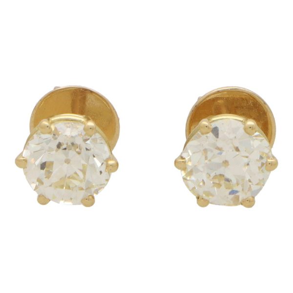 Old European cut diamond stud earrings set in gold.