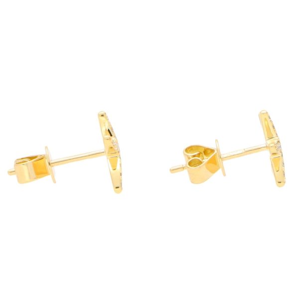 Modern diamond starfish stud earrings set in yellow gold.