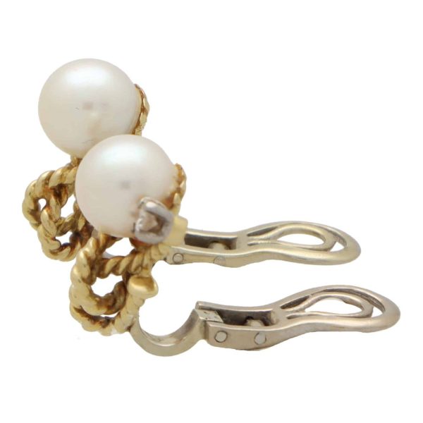 Pearl and diamond twisted rope earrings in gold.