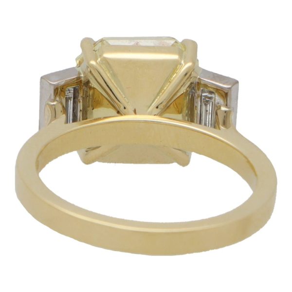 Natural 5.03 carat yellow diamond ring set in yellow gold and platinum.