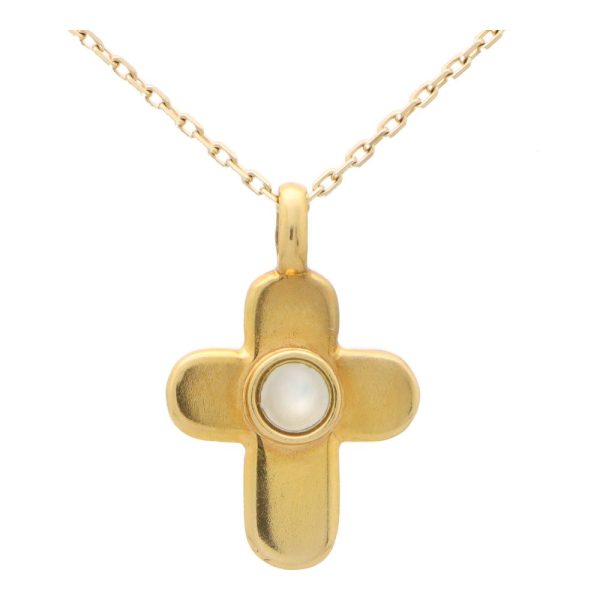 Van Cleef and Arpels mother of pearl cross pendant necklace set in yellow gold.