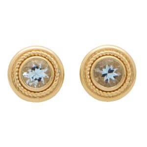 Aquamarine stud earrings set in yellow gold.