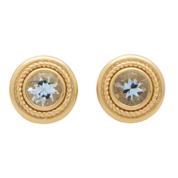 Aquamarine stud earrings set in yellow gold.