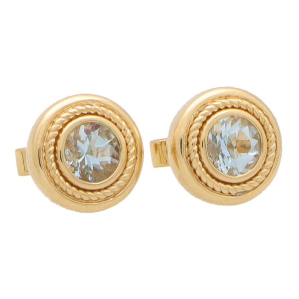 Aquamarine stud earrings set in yellow gold.