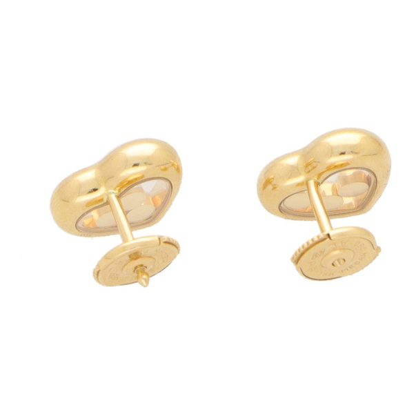 Chopard diamond heart stud earrings set in yellow gold.