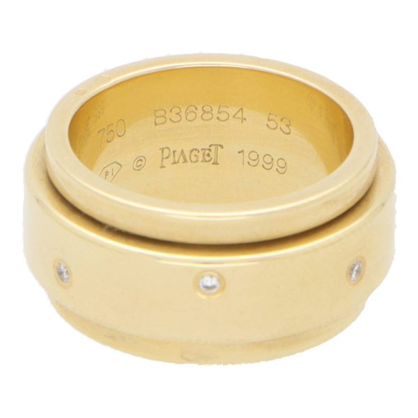 Piaget diamond band ring set in yellow gold.