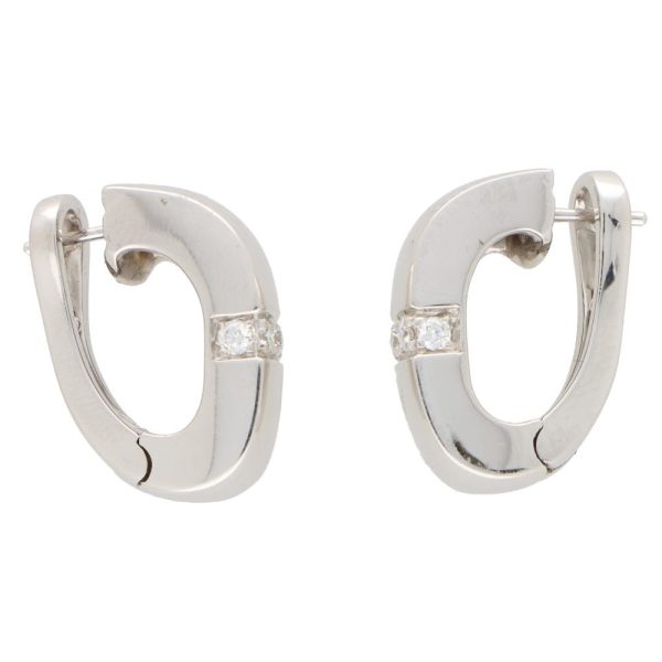 Vintage Mauboussin Paris diamond chunky huggie hoop earrings in white gold.