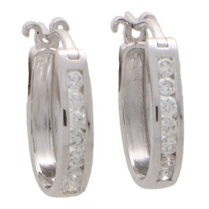 Diamond hoop earrings set in 14 carat white gold.