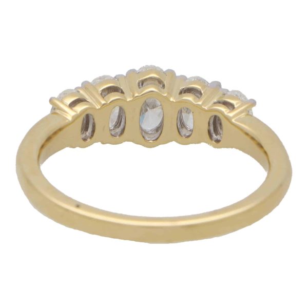 Diamond five stone ring set in yellow and white gold.