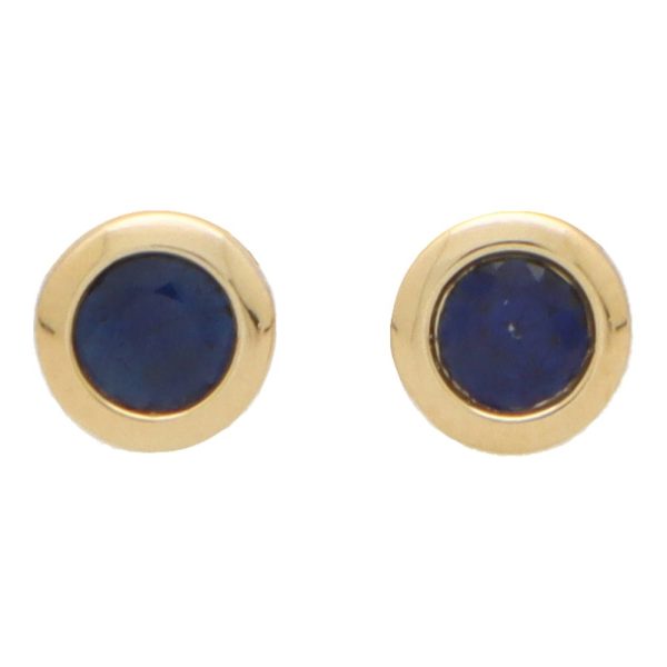 Sapphire stud earrings set in yellow gold