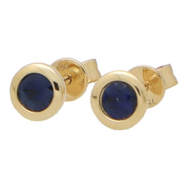 Sapphire stud earrings set in yellow gold