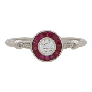 Diamond and ruby target ring in white gold.