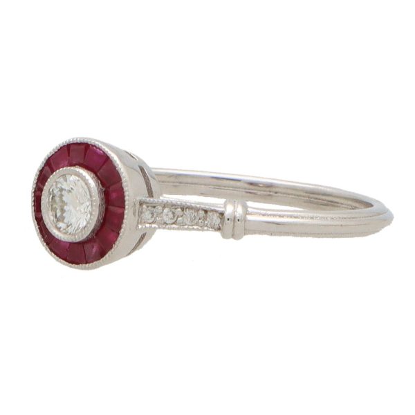 Diamond and ruby target ring in white gold.