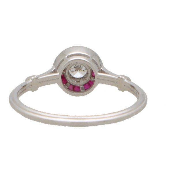 Diamond and ruby target ring in white gold.