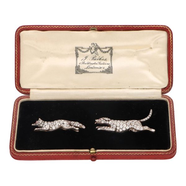 Victorian diamond fox and hound brooches set in silver on gold.