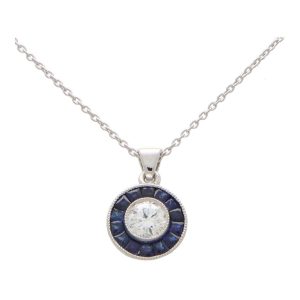 Diamond and sapphire target necklace in white gold.