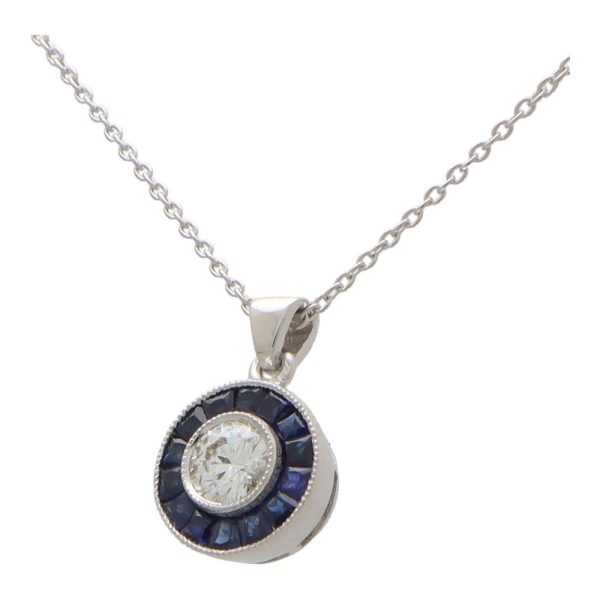 Diamond and sapphire target necklace in white gold.