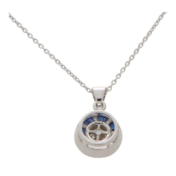 Diamond and sapphire target necklace in white gold.