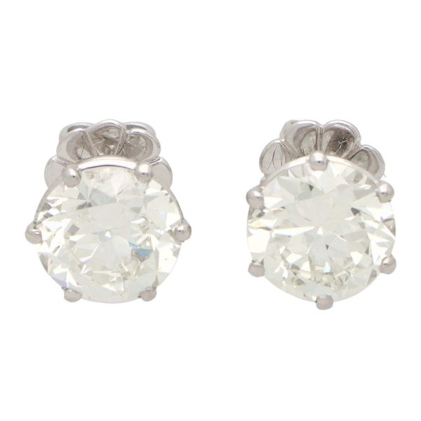 Solitaire certified diamond stud earrings set in gold,
