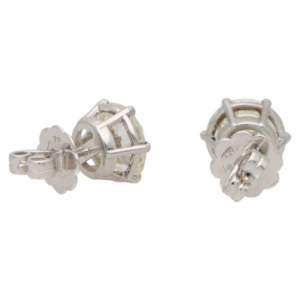 Solitaire certified diamond stud earrings set in gold,