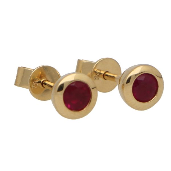 Ruby stud earrings set in 18 carat yellow gold.