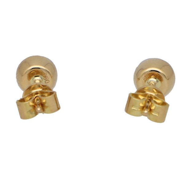 Ruby stud earrings set in 18 carat yellow gold.