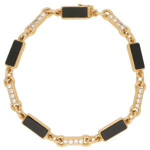 Van Cleef and Arpels onyx and diamond chain link bracelet in gold.