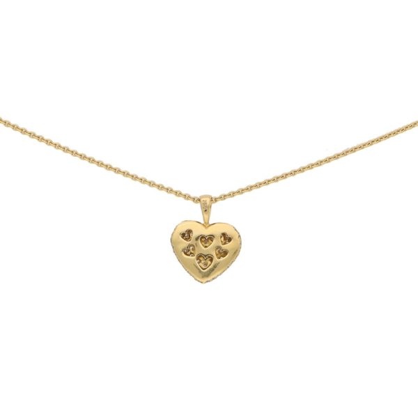 A diamond heart pendant in gold.