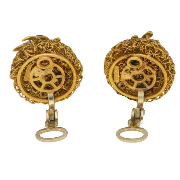 A pair of gold wire work clips earrings set with enamel leaves and diamonds.
