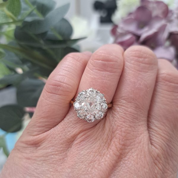 3.10ct Old Cut Diamond Daisy Cluster Engagement Ring, 1.40ct old-cut diamonds surrounded by eight smaller diamond totalling an additional 1.70 carats