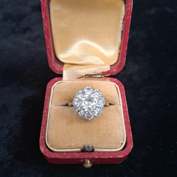 3.10ct Old Cut Diamond Daisy Cluster Engagement Ring, 1.40ct old-cut diamonds surrounded by eight smaller diamond totalling an additional 1.70 carats