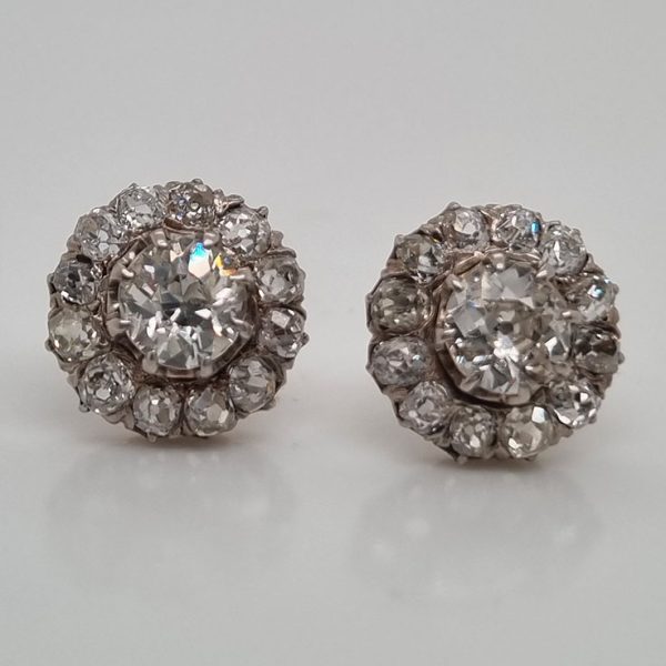 Victorian Antique 2.90ct Old Cut Diamond Cluster Stud Earrings, 0.70ct old-cut diamond centres surrounded by smaller old-cut diamonds, 2.90 carat total